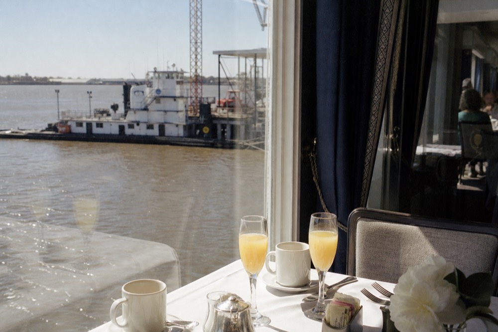 Weekend jazz brunch cruise table with a view of the river in daylight